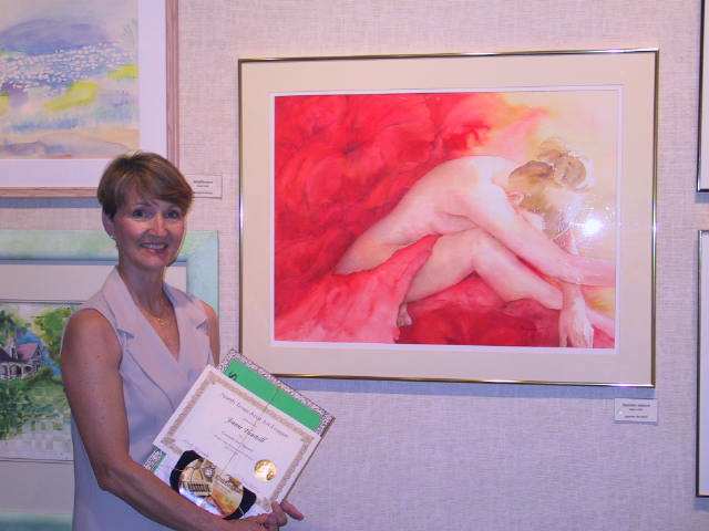 Jeanne standing by trailer